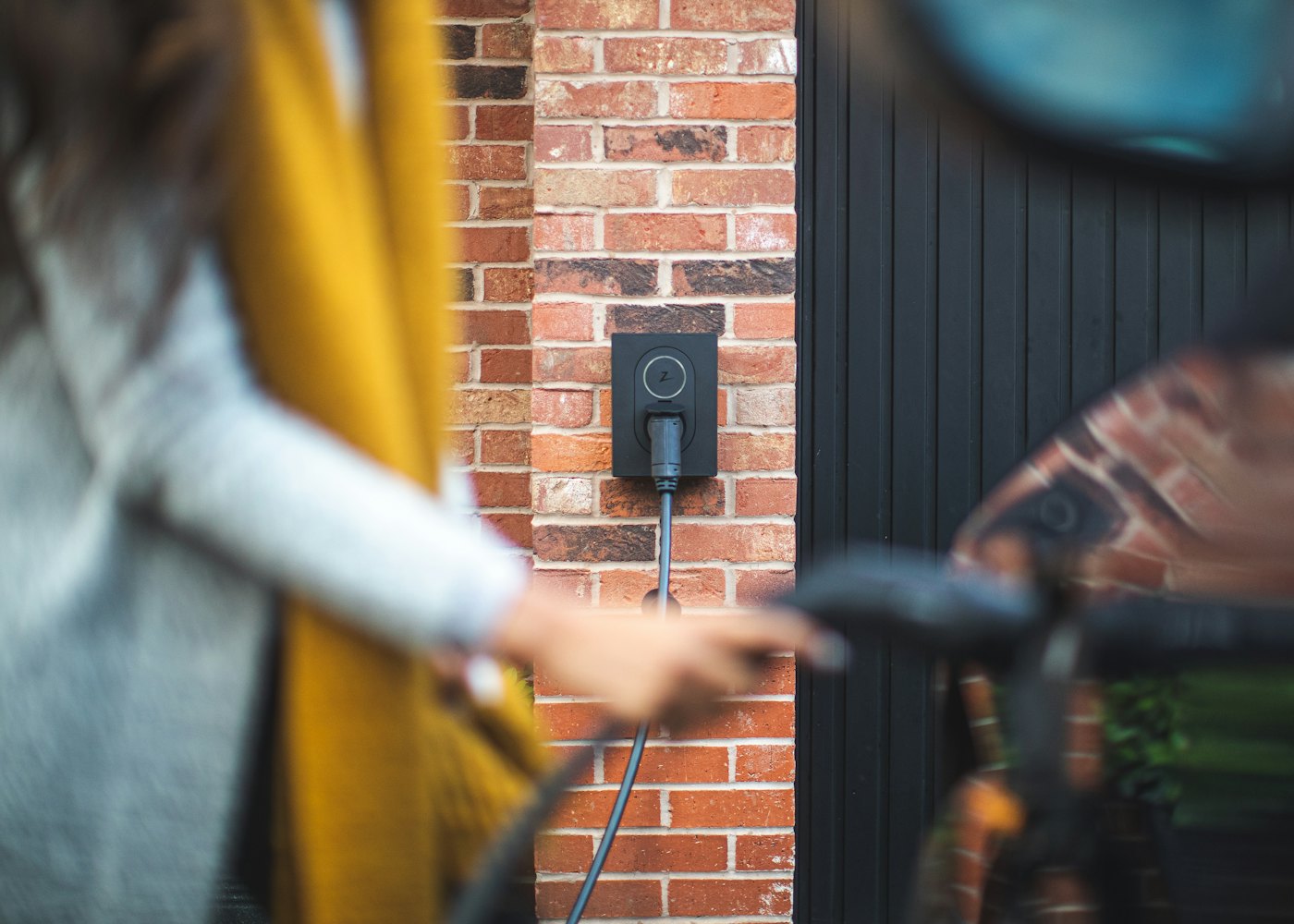 Electric car plugged in to a charger