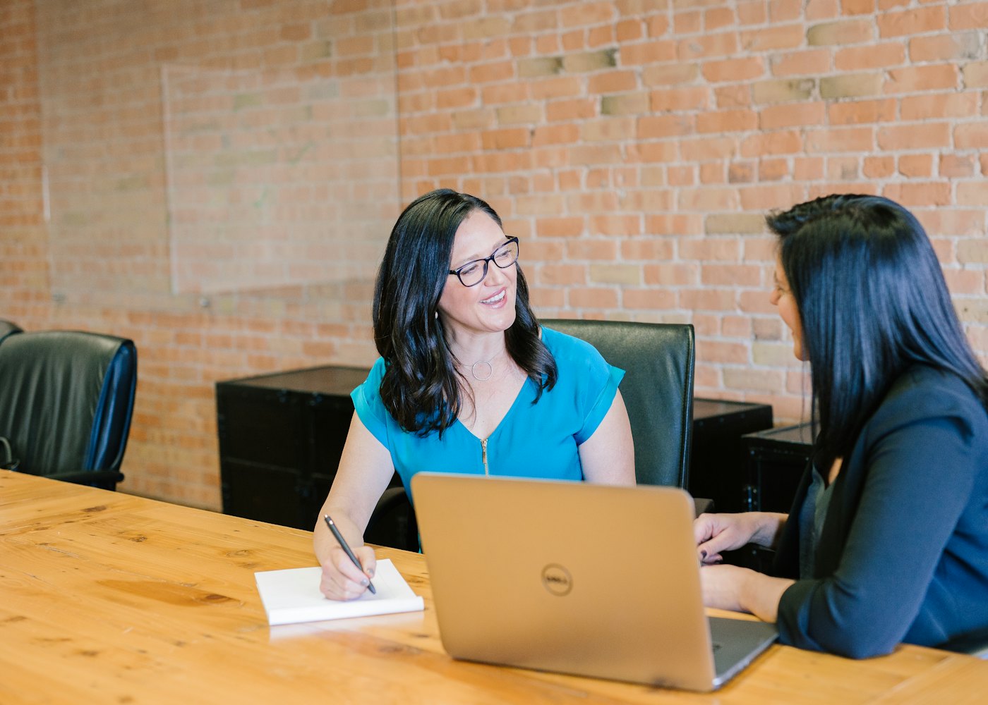 Accountant and client reviewing figures together at a table